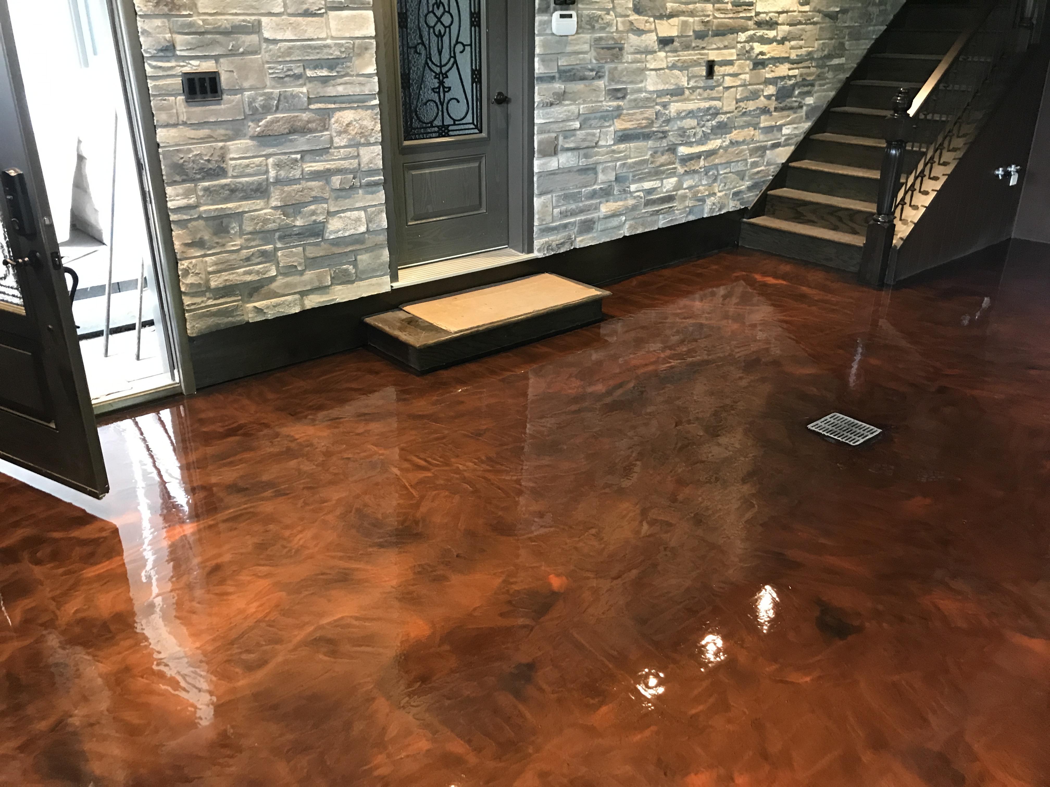 Glossy copper-toned decorative metallic floor with rich colour variation